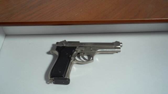 having weapons at home in a drawer ,  more and more people in the USA have a revolver gun for personal defense, increase in homicides and terrorist attack 