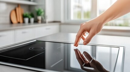 A hand delicately grazes the surface of a sleek marble countertop in a bright, modern kitchen filled with natural light.