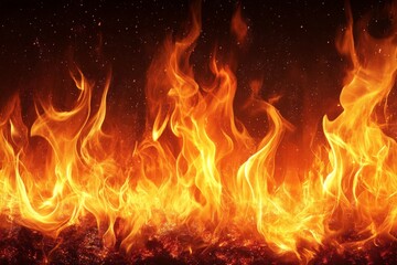 Fototapeta premium Vivid flames dancing against a dark backdrop, creating a mesmerizing display of heat and light