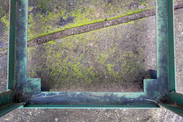 Top View of Square-Shaped Steel Plate on a Rough Concrete Surface