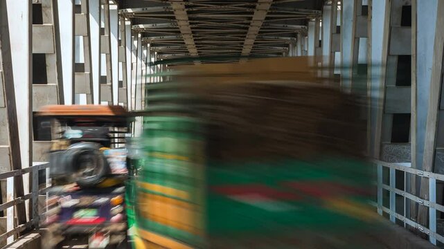 Timelapse view of rush hour traffic on the colonial-era Strachey Bridge in Agra, Uttar Pradesh, India. 