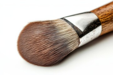 Fototapeta premium Close up view of a makeup brush with soft bristles on a white background