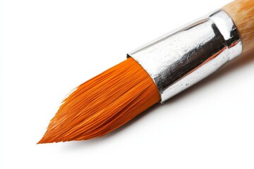 Fototapeta premium Bright orange paintbrush ready for artistic creation on a clean white background
