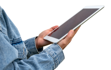 Cutout digital tablet with blank screen in hands of female wearing denim jacket.