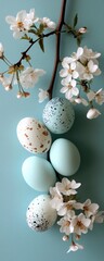 Pastel Easter Eggs and Blossoms: Delicate pastel-colored Easter eggs nestled amongst the delicate blossoms of a cherry branch, creating a serene and elegant springtime scene.