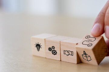 New product development and project roadmap concept. Wooden blocks with the stages of new product...