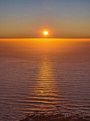 Sun setting on the horizon over the sea, Cape Town, South Africa