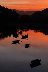 Boats in the port of San Vicente de la Barquera at sunset. Cantabria, Spain.