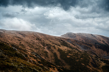 Dramatic Hills Under Cloudy Sky
