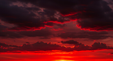 Fototapeta premium Dramatic Sunset Sky with Intense Red and Orange Clouds 