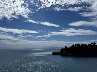 Sea blue glittering water, amazing heaven and scenic rocky Adriatic coast in Montenegro. 