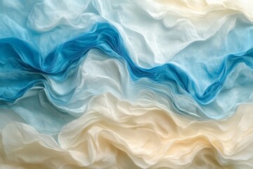 Obraz premium Flowing layers of blue and cream fabric create a serene and textured visual in a soft, dreamlike arrangement