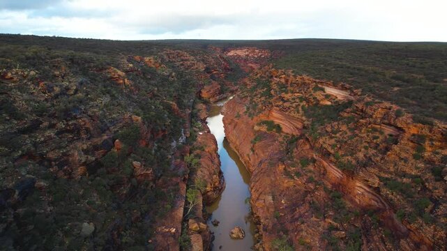 Aerial view of majestic Z Bend gorge with rugged cliffs and a tranquil river, Kalbarri National Park, Western Australia, Australia.