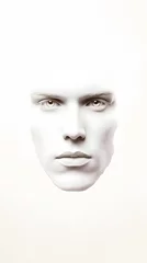 44. A frontal image of a human face with deep-set eyes and angular cheekbones, on a white background © Obee
