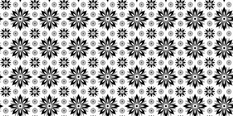 Black and white floral pattern with bold symmetrical designs