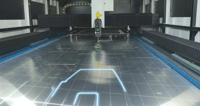 CNC laser cutting machine at work. Metal laser cutting machine close-up. CNC laser machine at the factory. Cutting metal with a laser CNC machine.