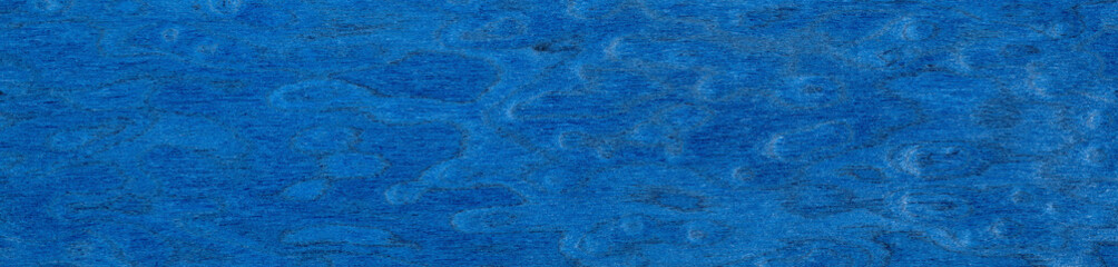 A vibrant sapphire journey across this elm burl veneer, where indigo meets navy in a serene woodland dance