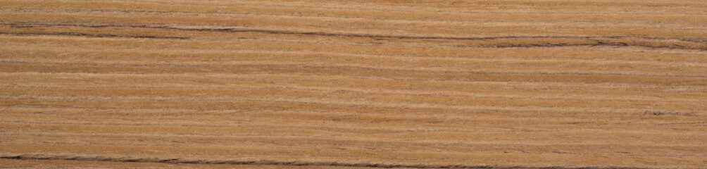 A tapestry of cinnamon and nutmeg swirls unfurls across the distinguished teak veneer