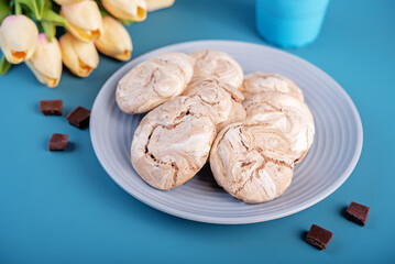 Chocolate meringue cookie in a plate
