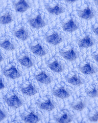 Close-up of Light Blue Knitted Fabric with Grid Pattern