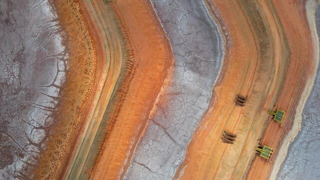 Aerial view of abstract patterns and textures of Redbank salt farm, Pilbara Region, Australia.