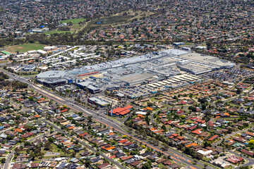 Aerial view of urban landscape with residential areas and shopping center, Hoppers Crossing, Australia.