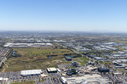 Aerial view of urban landscape with modern buildings and expansive skyline, Epping, Victoria, Australia.