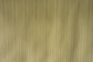 View of light olive green striped cotton and polyester fabric from above