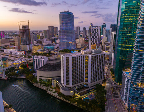 Aerial view of vibrant Brickell skyline with modern skyscrapers and Miami River at sunset, Miami, United States.