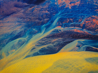Aerial view of colorful abstract patterns and textures in a vibrant landscape, Hvolsvollur, Islanda.