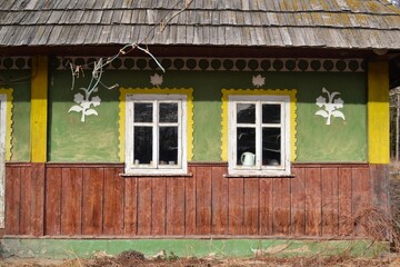 Facade of a house in Bukovina, Ukraine. Wall and windows, picturesque, background