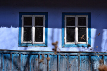 Facade of a house in Bukovina, Ukraine. Wall and windows, picturesque, background