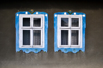 Facade of a house in Bukovina, Ukraine. Wall and windows, picturesque, background