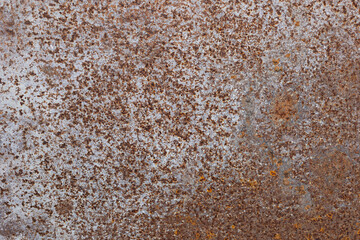 Rusty background, metal texture. Metal oxidizes with age. Rusty surfaces. Close-up from above.