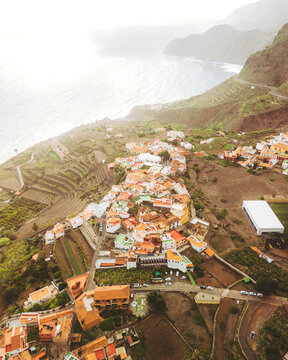 Aerial view of picturesque Agulo Stadium surrounded by rugged cliffs and serene ocean, Agulo, Spain.