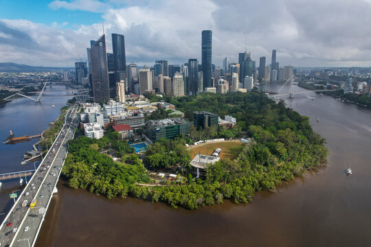 Aerial view of Brisbane City with beautiful skyscrapers, lush city botanic gardens, and the Brisbane River, Brisbane City, Australia.