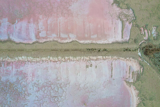 Aerial view of abstract patterns and beautiful colors of St Kilda salt farm, Adelaide, South Australia, Australia.
