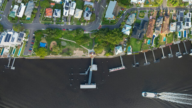 Aerial view of Hardcastle Park and Hawthorne ferry terminal along the Brisbane River with Queenslander houses, Hawthorne, Australia.