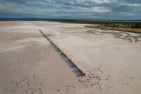 Aerial view of abstract salt mounds in a serene landscape, St Kilda, Australia.