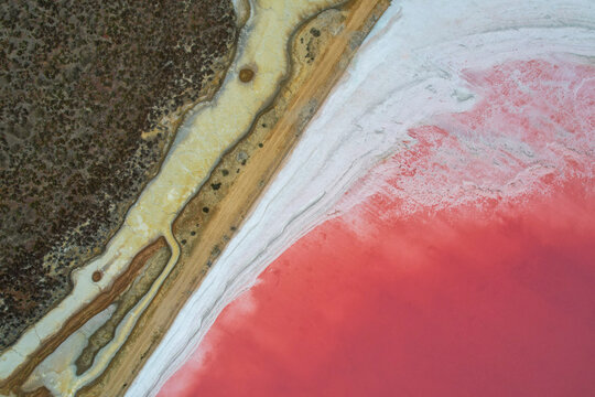 Aerial view of abstract salt farm with beautiful red and orange patterns, Mulgundawa, South Australia, Australia.