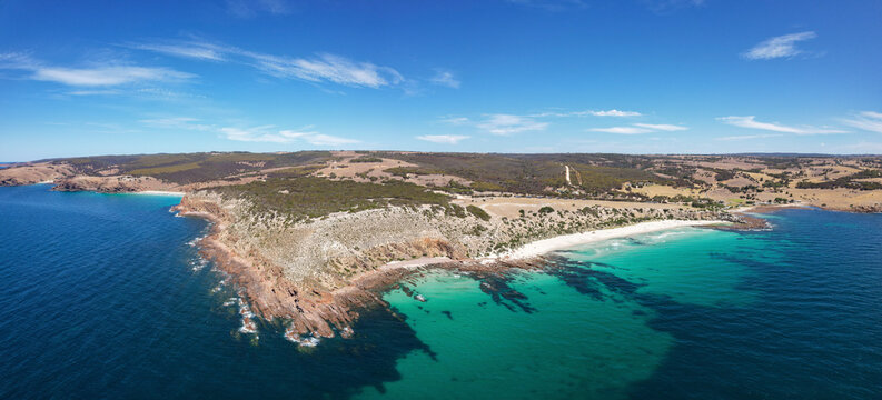 Aerial view of Stokes Bay Beach with sandy shoreline and tranquil blue ocean, Stokes Bay, Australia. - Powered by Adobe