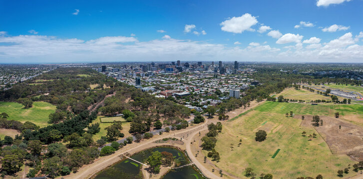Aerial view of victoria park wetlands and sports fields with greenery and buildings, adelaide, australia.