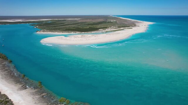 Aerial view of pristine beach with turquoise water and serene waves, Willies Creek, Kimberley Region, Australia.
