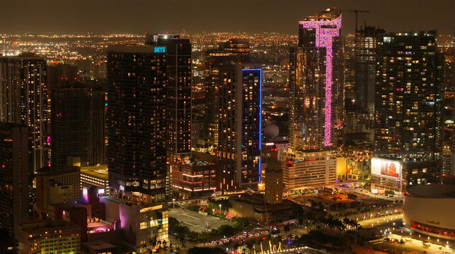 Aerial view of illuminated skyscrapers and city lights in downtown, Miami, United States.