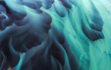 Aerial view of serene turquoise water with abstract patterns and shapes, Selfoss, Iceland.