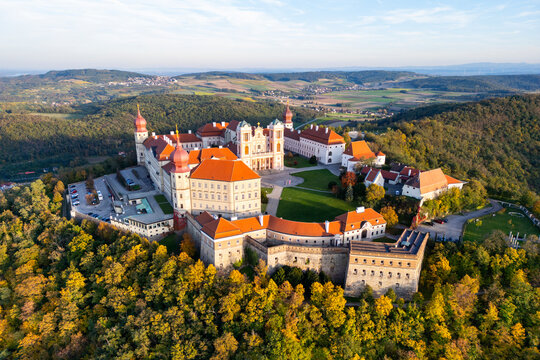 Aerial view of Stift Goettweig monastery and church surrounded by autumn foliage and rolling hills, Krems, Austria.