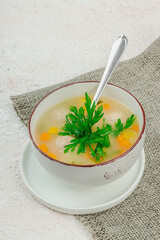 Hearty homemade Italian wedding soup with greens and meatballs