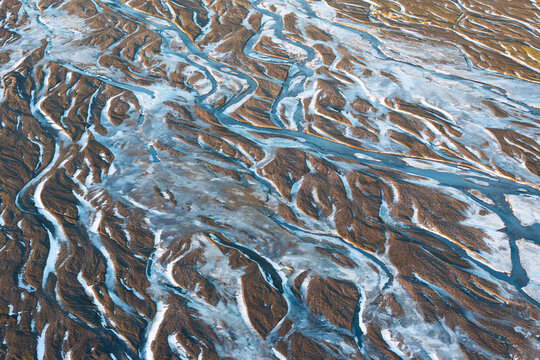 Aerial view of abstract river veins in a frozen river with beautiful patterns, Vik i Myrdal, Iceland.