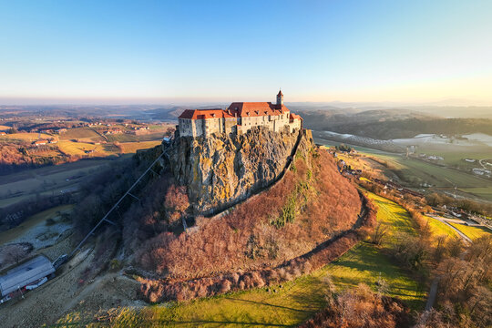 Aerial view of riegersburg castle, a majestic medieval fortress on a hilltop during sunset, Riegersburg, Austria.
