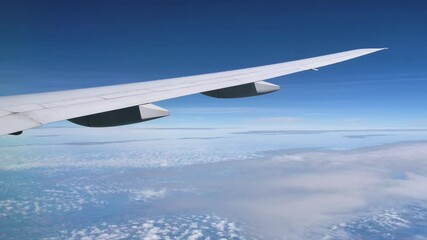 Wing Design of the Boeing B777 in Flight with Blue Sky Background
